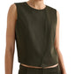 A person wearing the TWP High Neck Hidden Placket Vest in dark olive green with matching pants stands against a plain light background.