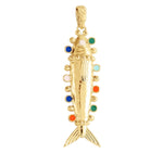 The Milos Medium Fish Charm by Anabel Aram is a gold fish-shaped pendant with textured details and vibrant circular blue, green, orange, and white accents—a striking piece inspired by Mediterranean jewelry.