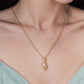 Anabel Aram Milos Shell with Pearl Charm gold chain necklace featuring a textured shell pendant accented by a tiny pearl.