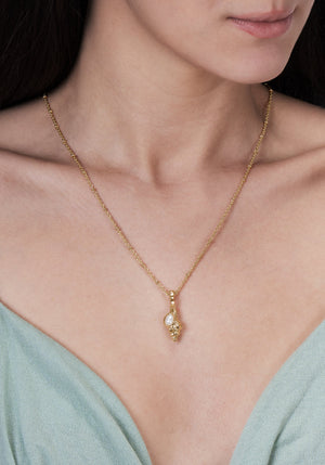 Anabel Aram Milos Shell with Pearl Charm gold chain necklace featuring a textured shell pendant accented by a tiny pearl.
