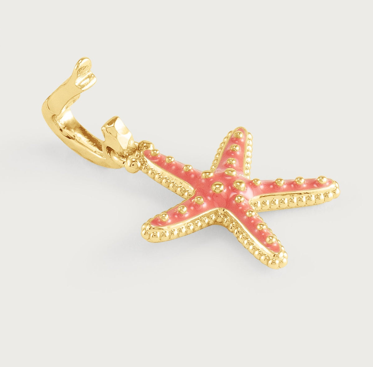 Anabel Aram Milos Starfish Charm in gold-plated metal with pink enamel inlay and a hinged clasp.