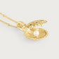 Anabel Aram Milos Shell Locket Charm, a gold shell locket on a chain featuring a single white pearl and small green stones set into the shell exterior.