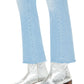 A person styled in Mother Denim The Insider Ankle Fray by Mother, paired with silver ankle boots featuring a block heel.