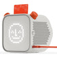 The Yoto Player by Yoto is a child-friendly audio device designed as a white cube with a pixelated face display and orange buttons. An orange card slot is located on the top, and an orange cable connects to the side, providing an ideal screen-free listening experience for kids.