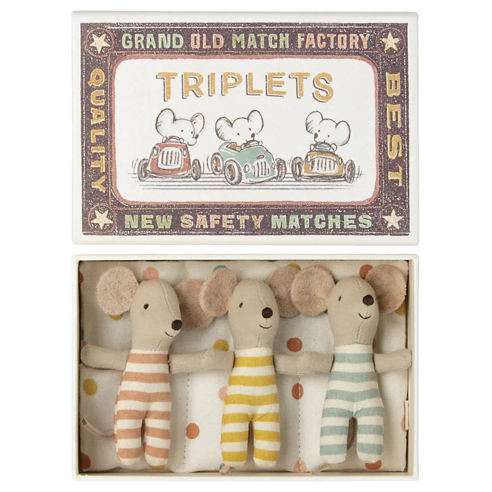 Maileg’s Baby Triplets in Box features three baby mice in striped outfits, snuggled together on a polka dot blanket.