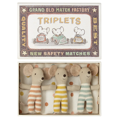 Maileg’s Baby Triplets in Box features three baby mice in striped outfits, snuggled together on a polka dot blanket.