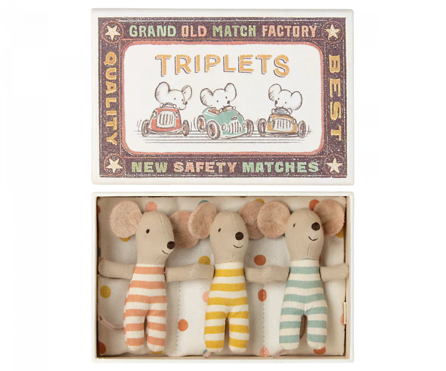 The Maileg Baby Triplets in Box, an ideal gift for kids, comes in a matchbox labeled "TRIPLETS" and features charming illustrations of mice driving cars. Inside, you'll find three adorable baby mice triplets dressed in orange, yellow, and green striped outfits. These delightful toys are crafted from recycled polyester by Maileg, making them an eco-friendly choice.