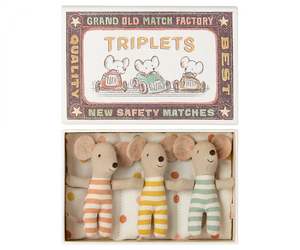 The Maileg Baby Triplets in Box, an ideal gift for kids, comes in a matchbox labeled "TRIPLETS" and features charming illustrations of mice driving cars. Inside, you'll find three adorable baby mice triplets dressed in orange, yellow, and green striped outfits. These delightful toys are crafted from recycled polyester by Maileg, making them an eco-friendly choice.