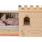A Maileg Princess and the Pea Mouse playset with a Princess Mouse doll and multiple layered mattresses.
