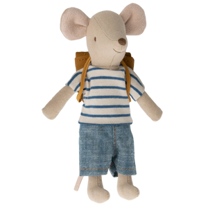 The Maileg Tricycle Mouse, Big Brother with Bag, features a plush mouse toy in a blue and white striped shirt, denim shorts, and a brown backpack.