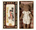 The Maileg Big Sister Mouse in Matchbox - Pyjamas comes dressed in white pajamas and rests in a vintage-style box, making it a charming collectible for any soft toy enthusiast.