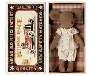 The Maileg Big Sister Mouse in Matchbox - Pyjamas comes dressed in white pajamas and rests in a vintage-style box, making it a charming collectible for any soft toy enthusiast.
