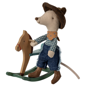 The Maileg Cowboy Mouse on Rocking Horse, Little Brother, wears a cowboy hat, bandana, and jeans as he rides a green wooden rocking horse—adding wild west charm to your playroom.