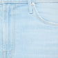 Close-up of the front pocket and button area of Mother’s The Mid Rise Dazzler Crop Fray, made from recycled stretch denim in a light blue wash.