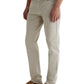 A person wears Tellis AG-ed™ Modern Slim Denim jeans by AG Jeans in light beige, paired with a white shirt and brown suede loafers, standing against a plain background.