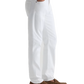 A person is shown standing with one hand in a pocket against a plain white background, wearing AG Jeans’ Tellis Cloud Soft Denim™ Jeans in a slim fit, paired with a dark blue shirt and brown loafers.