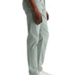 A person in side view wears AG Jeans' Tellis Modern Slim Sueded Stretch Sateen jeans in light green, paired with a white t-shirt and white sneakers with brown soles, set against a plain light background.