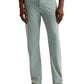 A person in AG Jeans' Everett Slim Straight Leg men's pants in light green, paired with a white shirt and brown suede shoes, stands against a plain background.