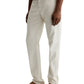 A person shown from the waist down wears AG Jeans Everett Slim Straight Leg off-white cotton-linen pants, a dark green shirt, and tan suede loafers.
