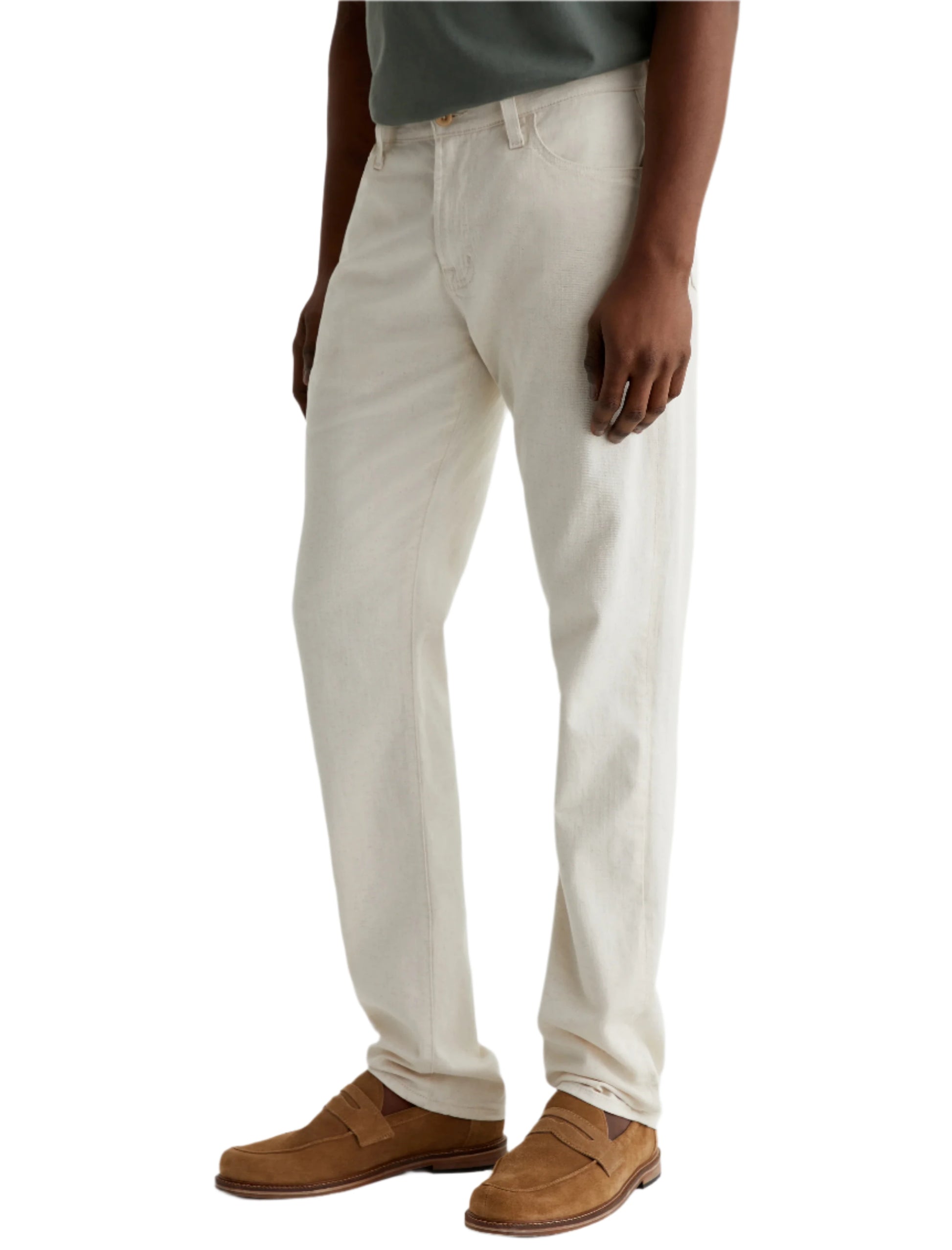 A person shown from the waist down wears AG Jeans Everett Slim Straight Leg off-white cotton-linen pants, a dark green shirt, and tan suede loafers.