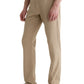 A person wears AG Jeans' Everett Slim Straight beige jeans with a mid-rise waist, paired with a white shirt and brown loafers, standing against a white background.