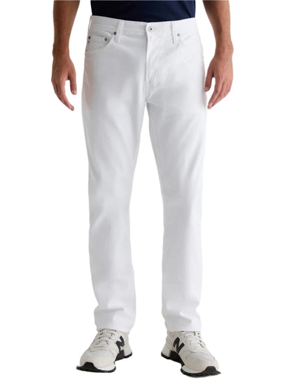 A person wears AG Jeans Everett Sueded Slim Straight white jeans and white sneakers, standing against a plain background, shown from torso to feet.