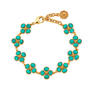 The Juliska Capucine De Wulf Berry Clover Link Bracelet features gold chain links with turquoise stone clusters and a secure lobster clasp, perfect for layering as a chic statement piece.