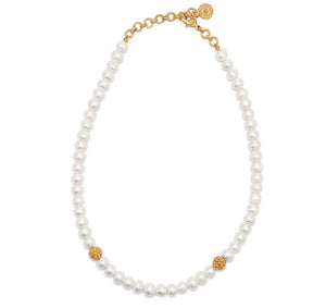 The Berry Single Strand Necklace by Juliska Capucine De Wulf features elegant pearls, two gold textured beads, and a gold adjustable chain clasp—adding timeless sophistication to any look.