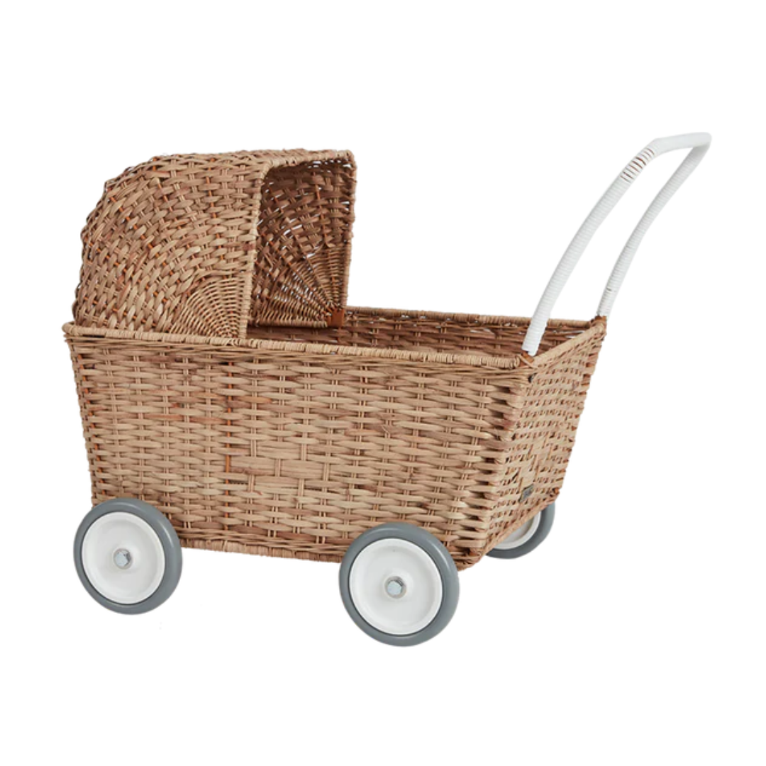 A brown convertible pram with wheels on a white background by Ollie and Ella