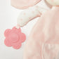 Blossom's Activity Toy by Bunnies By the Bay is a pink plush bunny with a flower-shaped teether for sensory development, featuring polka dot arms and a striped ear to engage your little one's senses.