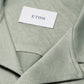 Close-up of the Eton Green Knitted Resort Shirt, featuring a textured light green fabric and visible white Eton label inside the collar, styled for an elevated look.