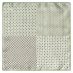 The Eton Mid Green 4-Sided Silk Pocket Square features a refined design with small dots, geometric shapes, and floral motifs in an elegant green and beige color scheme, offering sophisticated sartorial flair.