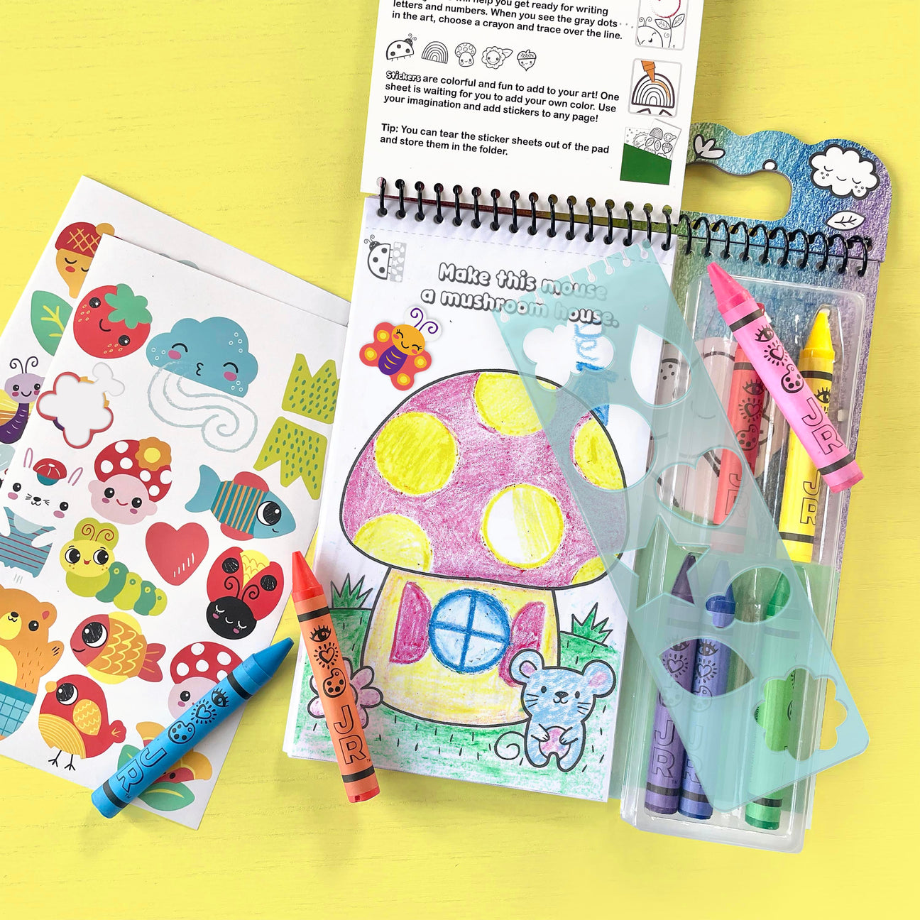 Discover Art on the Go! by Bright Stripes—a coloring set with a finished mushroom house drawing, animal stickers, crayons, and a stencil—perfect for sparking creativity wherever you are.