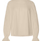 A Merlette New York Pima Cotton blouse with ruffled sleeves.