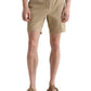 Someone wears AG Jeans' Oliver Short, a high-rise design in breathable twill with an adjustable drawstring, paired with brown sandals, standing against a plain white background.