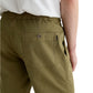 A person is shown from the back wearing AG Jeans’ Oliver Short in olive green, featuring a breathable twill blend, adjustable drawstring waist, and detailed back pockets.