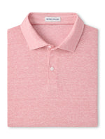 The Sanibel Polo by Peter Millar is a folded light pink collared linen-cotton shirt featuring a subtle heather pattern and the signature label inside the collar—an essential casual piece for your wardrobe.