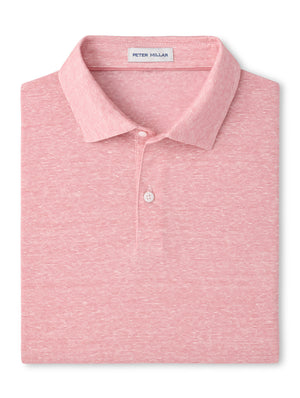 The Sanibel Polo by Peter Millar is a folded light pink collared linen-cotton shirt featuring a subtle heather pattern and the signature label inside the collar—an essential casual piece for your wardrobe.