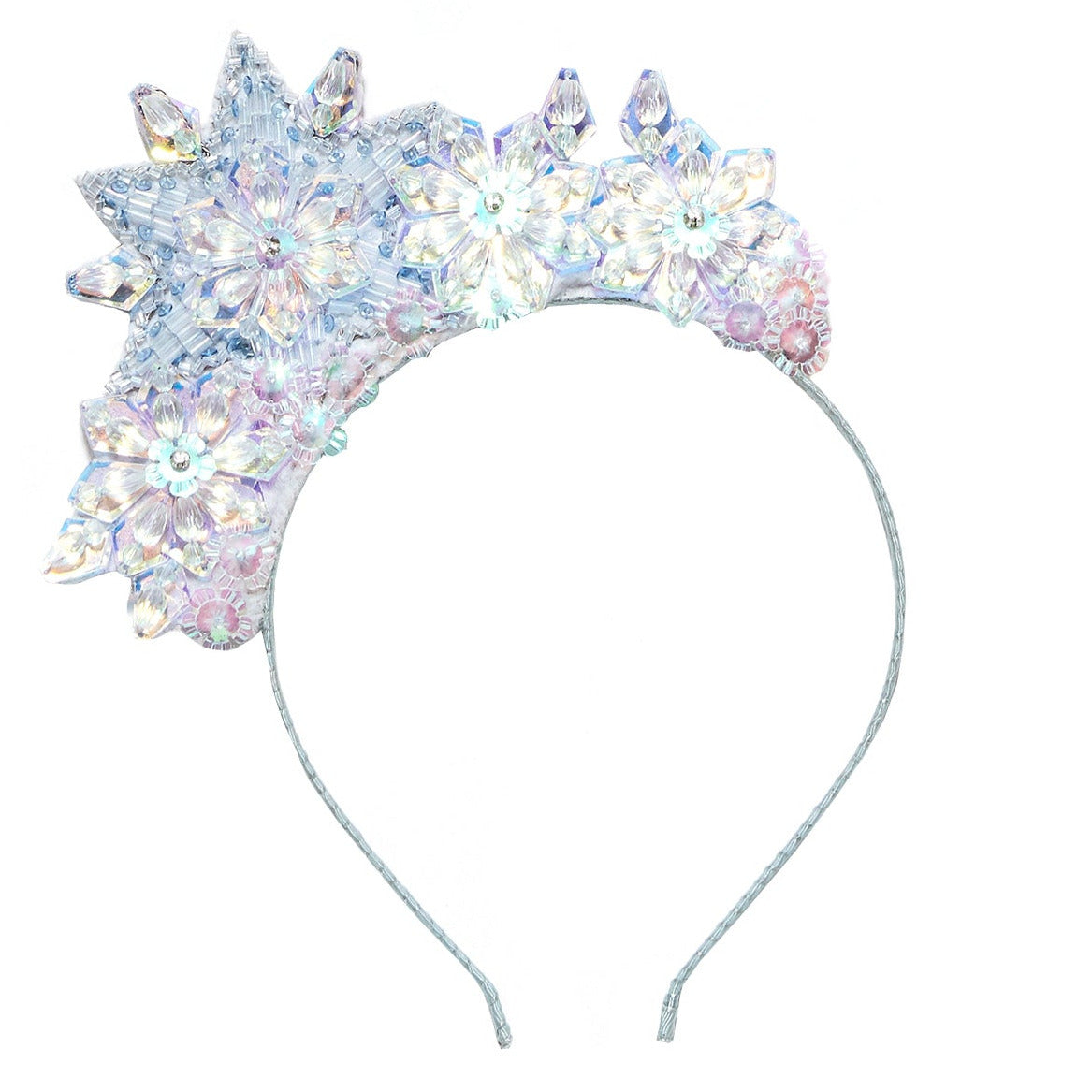 The Snow Queen Tiara by Tutu du Monde features a silver headband embellished with iridescent crystal flowers and star-shaped accents arranged on one side, creating a delicate floral design that perfectly completes any princess dress ensemble.