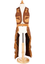 The Great Pretenders Cowboy Vest and Chaps, designed for ages 7-8, includes a rugged cowboy hat that pairs perfectly with the vest and fringed chaps, all elegantly displayed on a wooden mannequin stand.