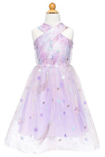 The Ombre Eras Lilac Dress by Great Pretenders is a child-sized lavender and pink tulle celestial gown featuring a crisscross halter neckline and adorned with sparkling stars—displayed on a mannequin, it’s the perfect magical pop star dress for little dreamers.