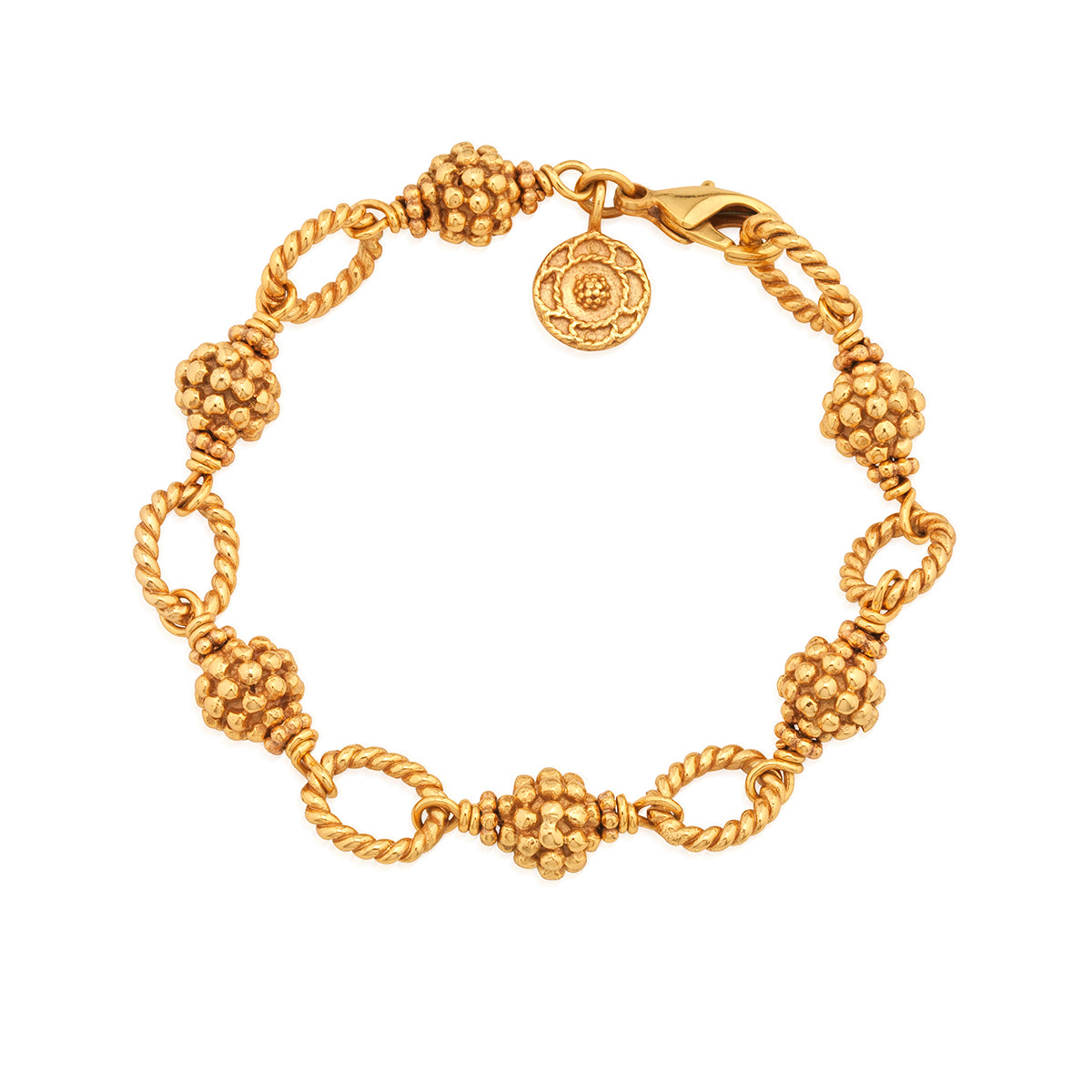 The Berry & Bead Bracelet by Juliska Capucine De Wulf features textured bead clusters, twisted chain links, a lobster clasp, and a round charm—perfect for layering.