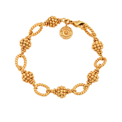 The Berry & Bead Bracelet by Juliska Capucine De Wulf features textured bead clusters, twisted chain links, a lobster clasp, and a round charm—perfect for layering.
