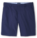 Peter Millar Surge Performance Shorts with a flat front design, side pockets, and a waistband with belt loops, featuring easy-care and water-resistant fabric.