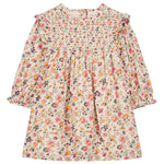 The Louise Misha Girls' Saralou Dress is a long-sleeved cotton gauze dress for children with a ruffled collar, smocked chest, and multicolored floral print on a light background.