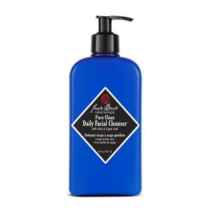 A 473 mL (16 fl oz) blue pump bottle of Jack Black Pure Clean Daily Facial Cleanser, formulated to help prepare shave-ready skin.