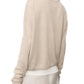 A person is pictured from the back wearing the Lisa Yang Abby Cashmere Cardigan in a featherweight, loose-fitted silhouette, paired with a light gray skirt creating an essential trans-seasonal look.