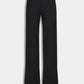 The Anouk Pant by Callas Milano features a black, high-waisted crepe jersey design with wide legs and a sleek silhouette, shown on a plain white background.