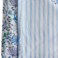 The Timo & Violet Crib Quilt is a silky soft, reversible quilt with ocean-themed sea creatures on one side and light blue and white stripes on the other, adding charming style to any crib.