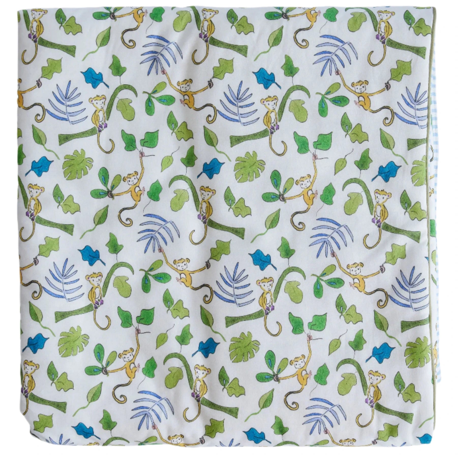 The Timo & Violet Crib Quilt features silky soft, eco-friendly bedding in white with a playful monkey pattern among green leaves and blue palm fronds—perfect for adding an adorable touch to your nursery.